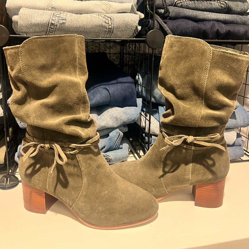 Olive green heeled boot with side zipper. Like new.